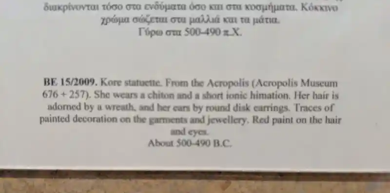 Marble kore statuette from the Acropolis wearing a chiton and ionic himation.